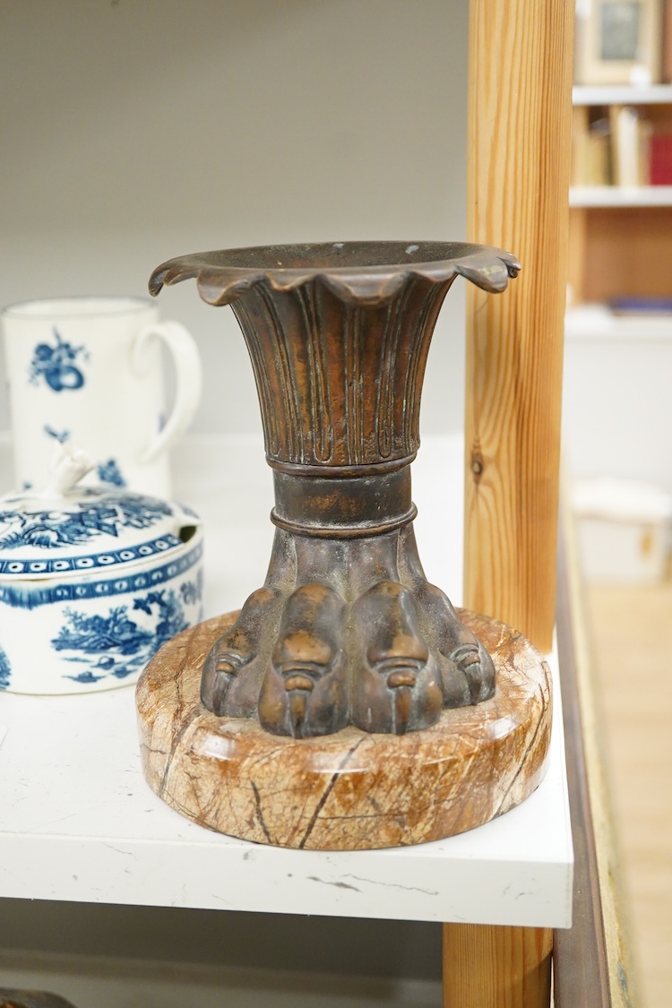 An Italian bronze vase in the form of a lion paw, raised on circular marble base, 17cm high